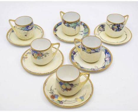 A set of Art Deco Rosenthal Donatello cups and saucers, hand painted by ME Reid in 1924