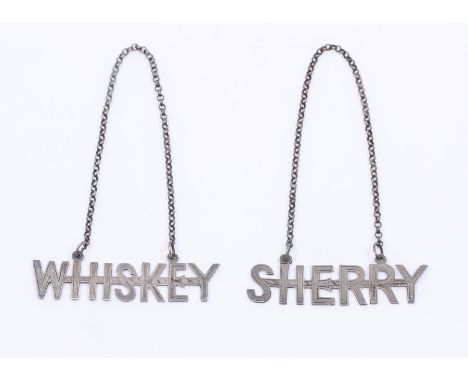 A pair of George V silver cut out bottle labels - WHISKEY &amp; SHERRY, hallmarked by William Hutton &amp; Sons, Sheffield, 1