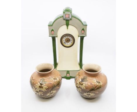 A Eichwald Arts &amp; Crafts pottery clock, with a pair of art pottery vases of the same period