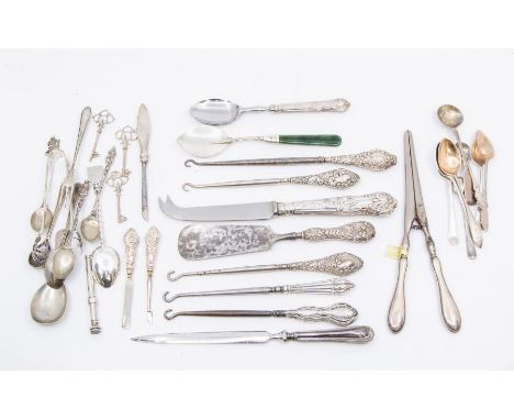 A collection of late Victorian and early 20th Century silver mounted button hooks, various dates and makers, filled handles t