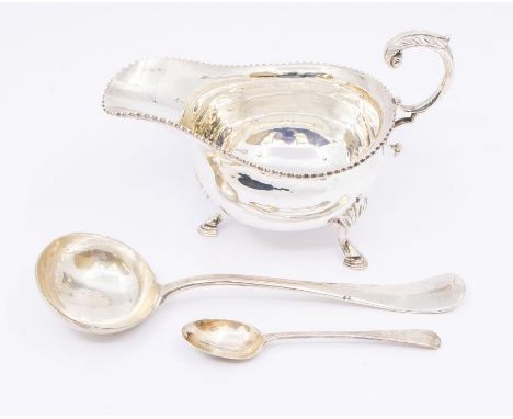 A collection of silver to include: Georgian style oval sauceboat, gadroon border on three shell and hoof feet, hallmarked by 