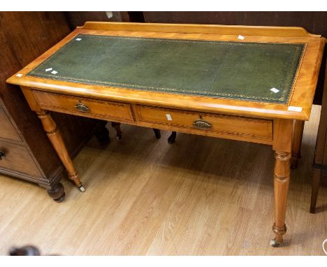 A Victorian ladies' writing desk in light mahogany, inlaid, with green leather writing surface