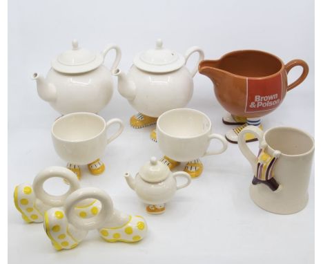 A collection of Carltonware "Walking Ware" to include: two standard teapots, miniature teapot, 4 cups, a mug, pair of bookend