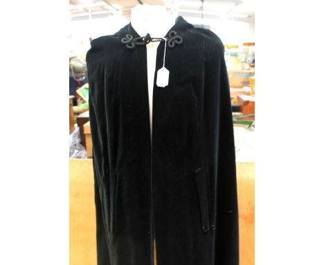 A Quad 1960's velvet hooded gown with single collar button and hood