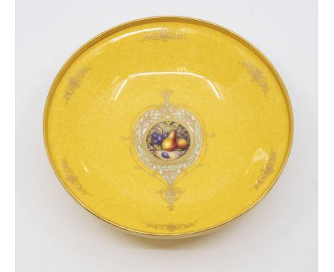 An early 20th Century Royal Worcester decorative bowl, shape no: 2769, mottled yellow ground with gilt raised border and foot