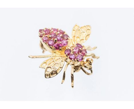 A ruby and 14k yellow gold bee pendant/ brooch, claw set with round cut rubies (one missing), size approx 20mm, pin and rolle