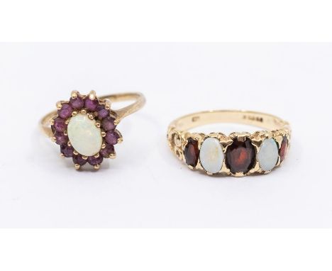 An opal and ruby 9ct gold oval cluster, opal within a border of round cut garnets,  size N, along with an opal and garnet fiv