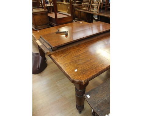    A Victorian oak wind-out table; with two extra leaves, on castors, length 150 cm, width 120cm, height 75cmC R: One leg has