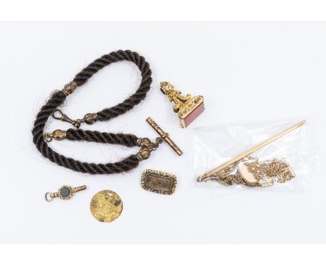 A 19th century hairwork albert chain, gilt metal terminals and t-bar; a 19th century gold mourning brooch, glazed compartment