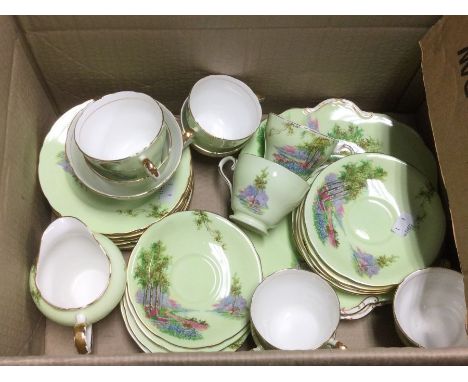 An Ansley 10 piece tea service in a country meadow scene