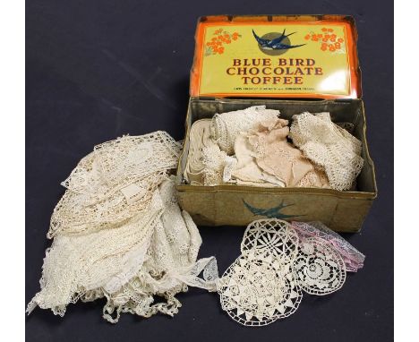 A good collection of 19th century lace work, including tea cosy cover; place pat/doilies, collar edges, lace edged bed spread