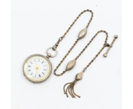 A late 19th century Swiss silver ladies fob watch, white enamel dial with Roman numeral markers and gilt decoration, case app