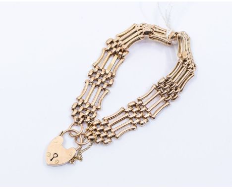 An early 20th century 9ct rose gold four link gate bracelet, polished links, padlock clasp, width approx 12mm, weight approx 