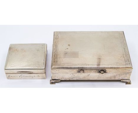 An Art Deco silver engine turned cigarette box, on four bracket feet, fitted interior, hallmarked by Britton, Gould &amp; Co.