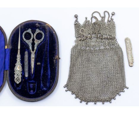 An early 20th century continental white metal chain mail bag, pouch style with chain drawstring to upper section, the top wit