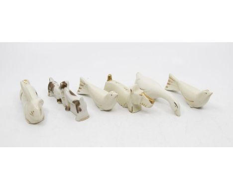 A collection of six Art Deco ceramic knife rests