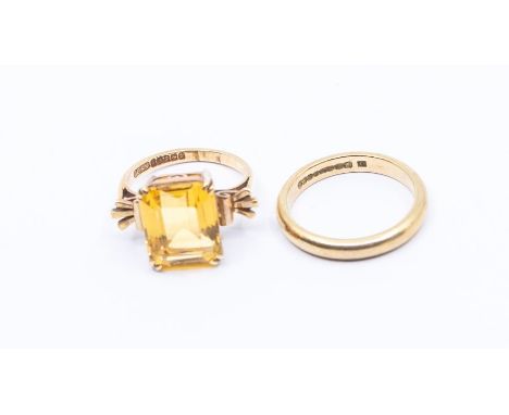 A 9ct gold and citrine fancy dress ring, comprising rectangular cut stone, size K, along with a 9ct gold D shaped band, size 