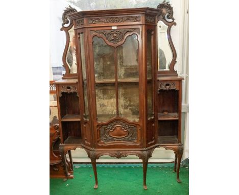 Late Victorian display cabinet on tapered legs, centralised glazed door, shelf with two side shelves and part mirrored back, 