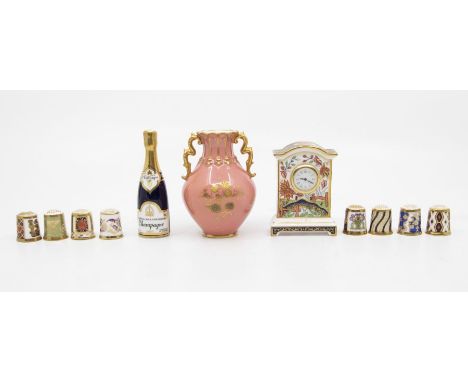 Royal Crown Derby miniature Haiku clock, eight thimbles, miniature champagne bottle and early pink ground vase