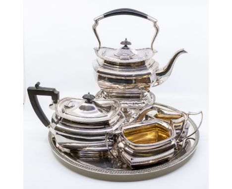 A Georgian style four piece silver plate tea service to include: tea kettle with stand and burner, teapot, sugar bowl and mil