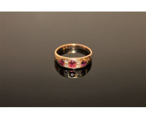 An antique 18ct gold ruby and diamond ring, 3.9g, size N/O.