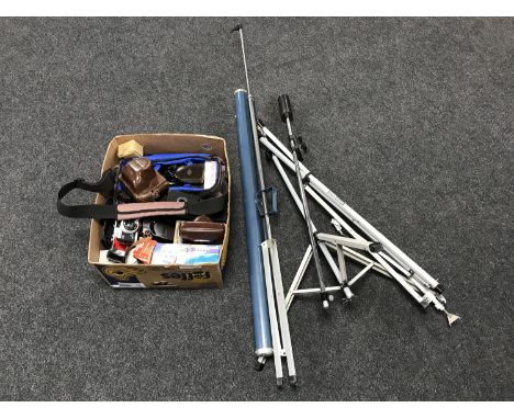 A box of assorted cameras and accessories with projector screen and camera flash stand 