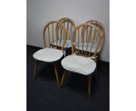 A set of four Ercol dining chairs  CONDITION REPORT: In good condition. 