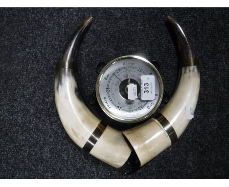 A cow horn barometer