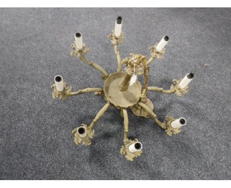 A continental gilt metal eight way light fitting 
