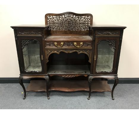 A Victorian mahogany chiffonier with a fret work panel 
