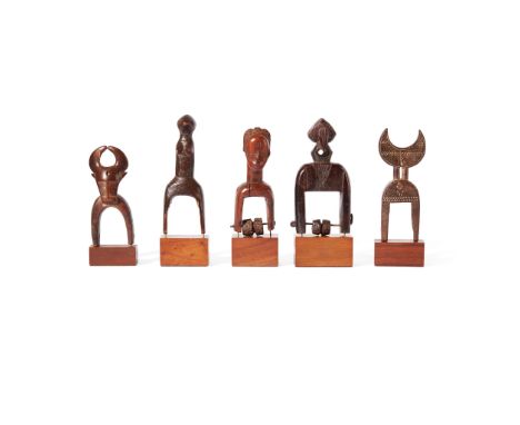 COLLECTION OF HEDDLE PULLEYS  CÔTE D'IVOIRE carved wood, consisting of; one Jimini pulley with curved horns and geometric fea