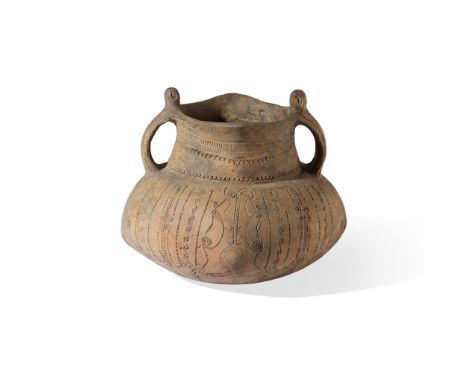 VINCA VESSEL  BALKANS, MID 5TH MILLENIUM B.C. fired and impressed terracotta, sitting on a rounded base, the globular body de