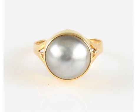 A grey mabe pearl dress ring, indistinctly stamped, ring size P. IMPORTANT: Online viewing and bidding only. No in person col