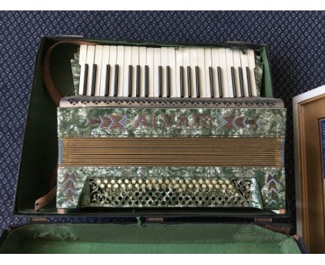 *An Alvadi green marble finish accordion, in case. IMPORTANT: Online viewing and bidding only. No in person collections, Mail