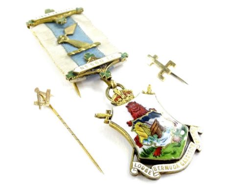 A silver gilt and enamel masonic jewel, relating to the first initiate, number 580 I.C. presented to Brother H Coombes, Bermu