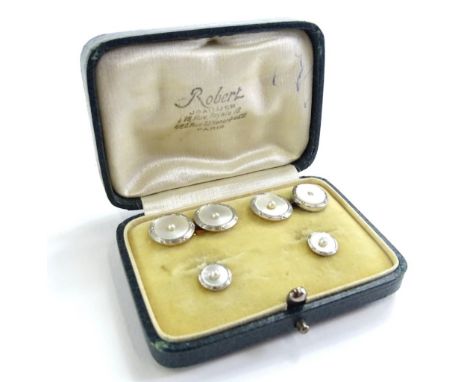 A cased set of mother of pearl tie and collar studs, comprising two collar studs, and a pair of cufflink's, each with mother 