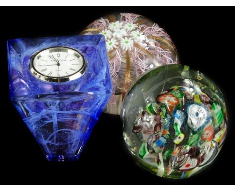 A Venetian style paperweight, decorated with a cluster of stars, metallic and pink intertwined bands, 7cm diameter, a millefi