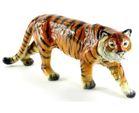 A Goebel ceramic model of a tiger, printed mark in blue to underside, 47cm L.