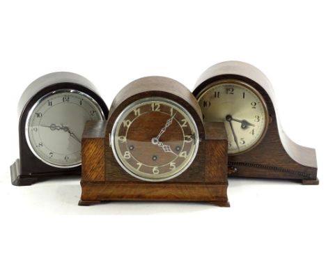 An Art Deco style mantel clock, in brown Bakelite case, 20cm H, and two oak mantel clocks. (3)