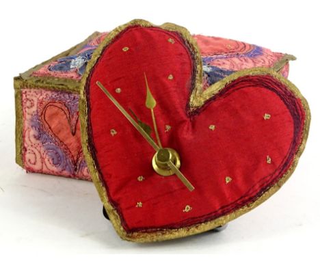 A Claire Sowden small fabric heart shaped clock, in a similarly embroidered travelling box with heart motifs.