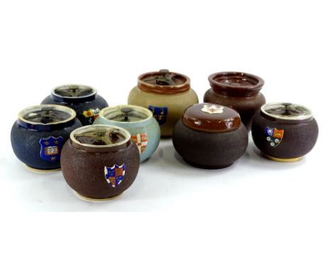 A collection of late 19th/early 20thc tobacco jars, mainly Carltonware, to include Oxford and Cambridge colleges, an example 