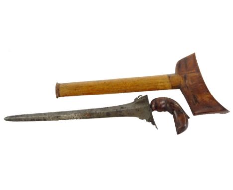 A 19thC Malayan Kris, with carved handle, tapering blade and wooden scabbard, 40cm L.