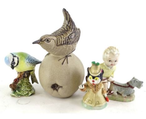 Various ceramic figurines, to include a Beswick bird, Poole bird, Wade cat, etc.