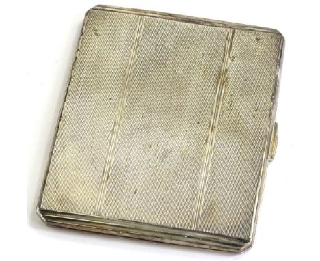 A silver Art Deco style cigarette case, with engine turned decoration, Birmingham 1942, engraved to the gilt interior To Jim 