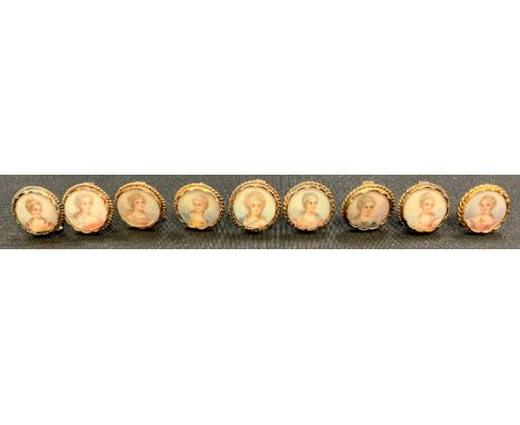 A set of nine Louis XV Revival gilt-metal menu or place card holders, each inset with a watercolour portrait miniature rounde