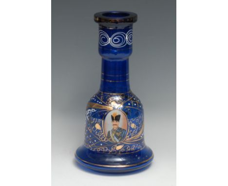 An Ottoman blue glass bell shaped hookah base, decorated in polychrome with a portrait of Sultan Mehmed VI, in gilt and white