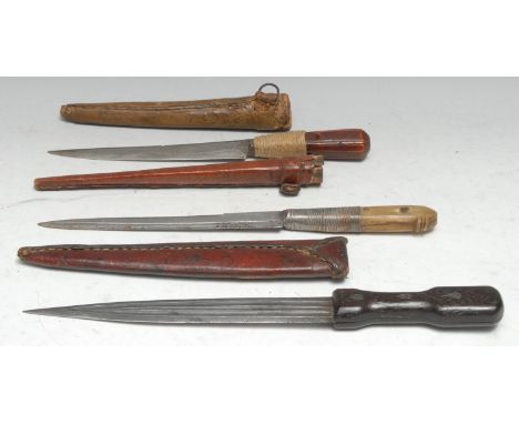 A Caucasian/Asian qama dagger, 21.5cm straight fullered blade, two-piece bamboo grip, leather scabbard, 35.5cm long overall, 