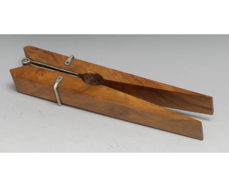 An early 20th century novelty lever-action nut cracker, as an oversize clothes peg, 21.5cm long 