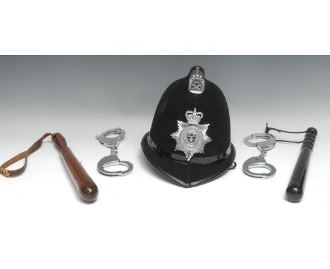 An early 20th century hardwood police truncheon, stamped GR 233, ribbed grip, 38cm long; another, mahogany; two pairs of Hiat