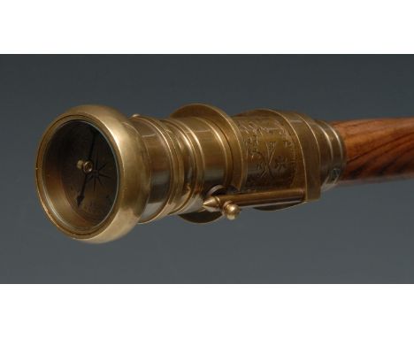 A novelty gentleman-topographer's lacquered brass and hardwood combination walking cane, the mechanical handle and ferrule en